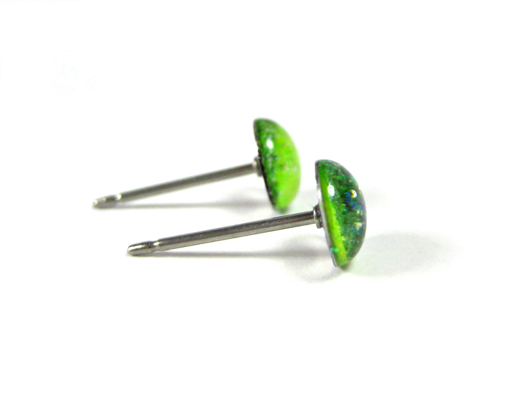 harlequin radiance half dark half light green glitter stud earrings