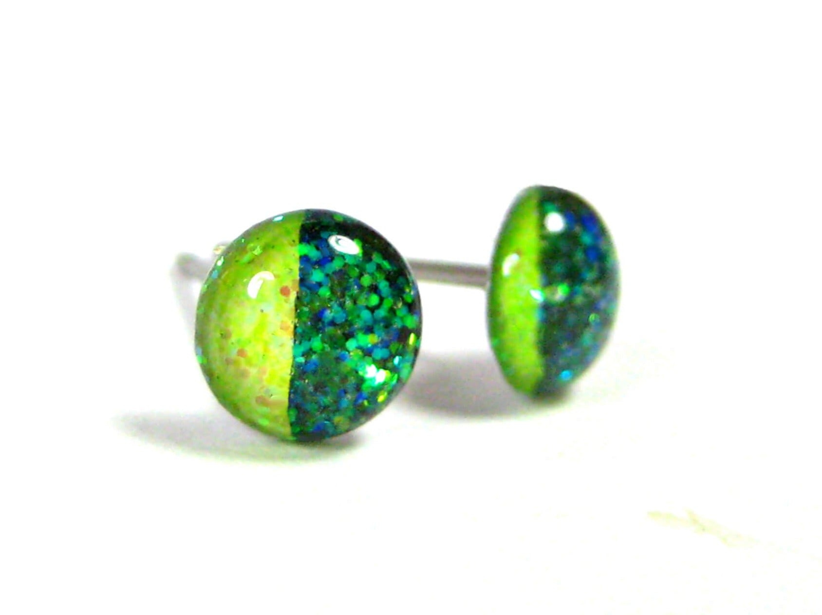 harlequin radiance half dark half light green glitter stud earrings